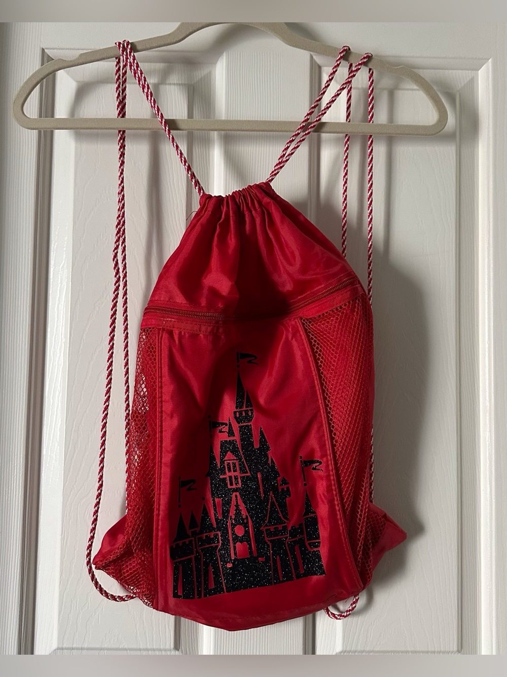 Disney Red Drawstring Castle Sling Backpack with Black Castle Graphic